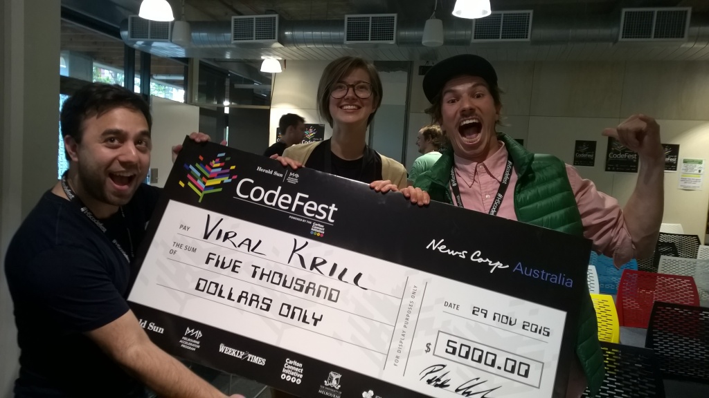 Viral Krill, with Leon from IBM celebrating with their novelty cheque